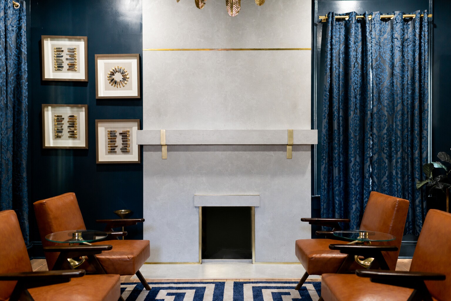 Close view of a concrete fireplace surround with custom brass inlay